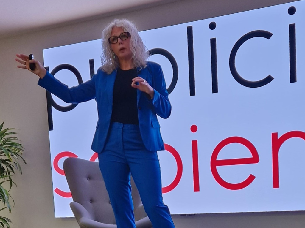 Kate Usher wearing a blue suit speaking